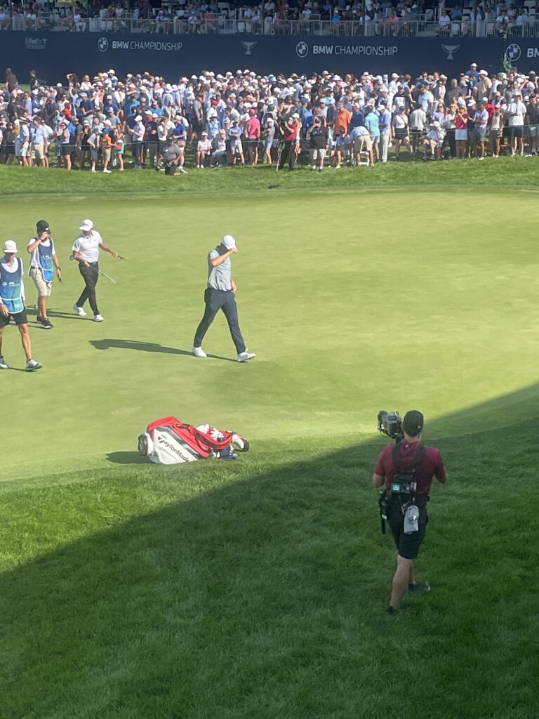 Scottie Scheffler walking off the 18th green at Olympia Fields' North Course in 2023